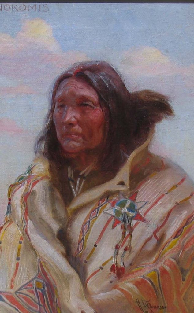 Oil painting by Harry Edwards (1869-1922). Head and shoulders image of a native American man against a partly cloudy summer sky.