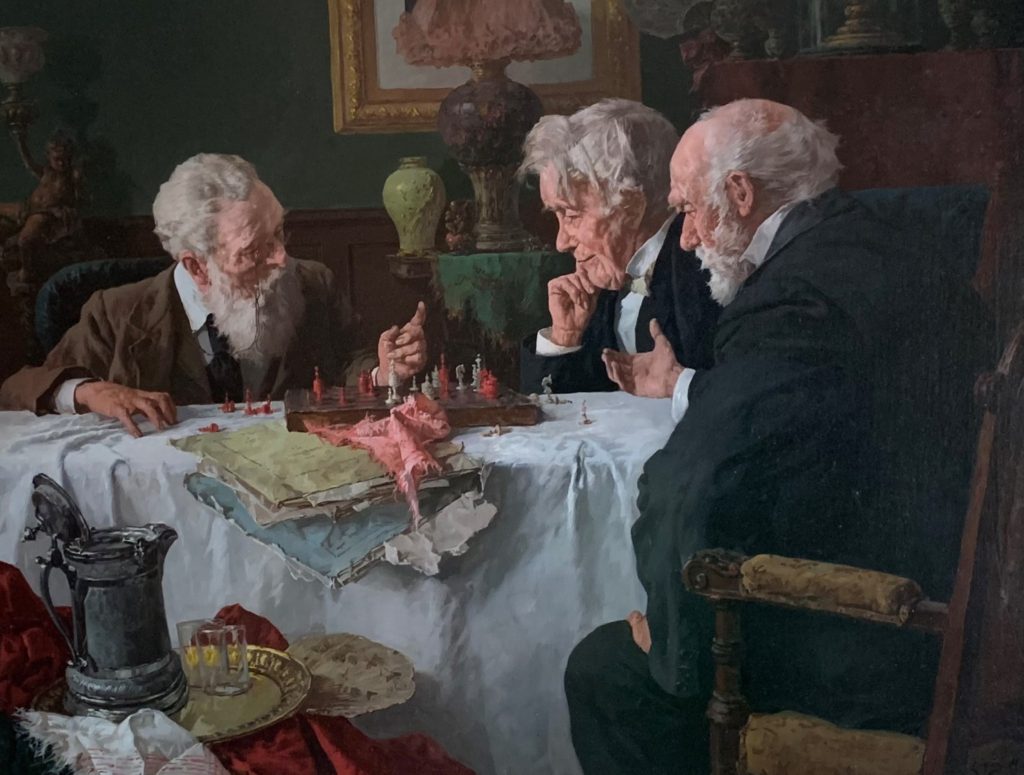 painting by Louis Charles Moeller of three old men leaning over a chess board.